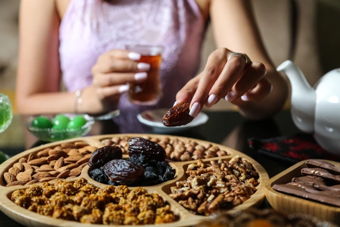 A travel snack box with dates and nuts