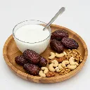 dates-nuts-yogurt-breakfast-isolated-white-background.webp